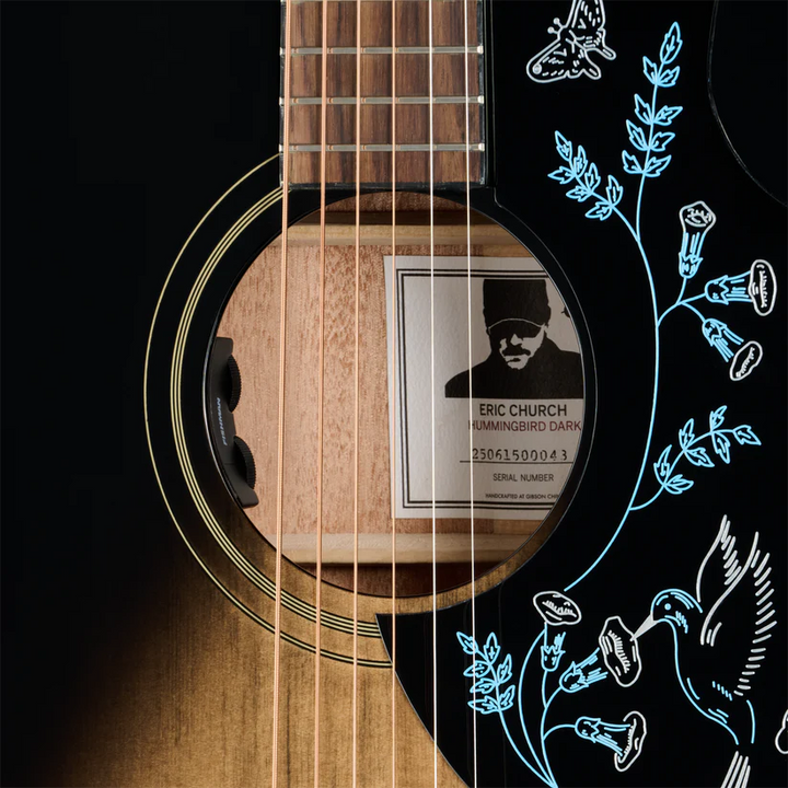 Acoustic guitar with a label and decorative elements 