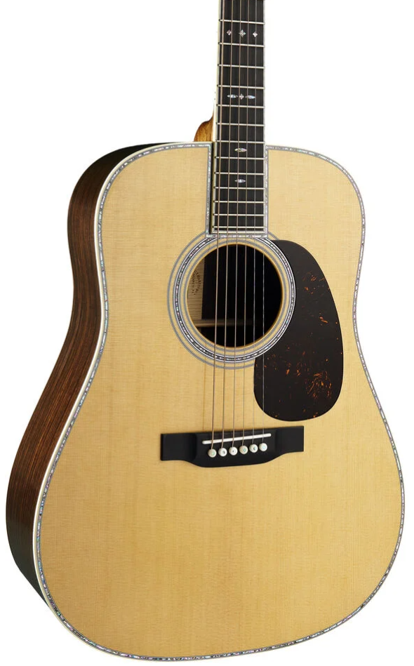 A close-up studio shot of a wooden acoustic guitar against a white background, showing the natural wood body, dark sides, soundhole rosette, pickguard, and part of the neck.