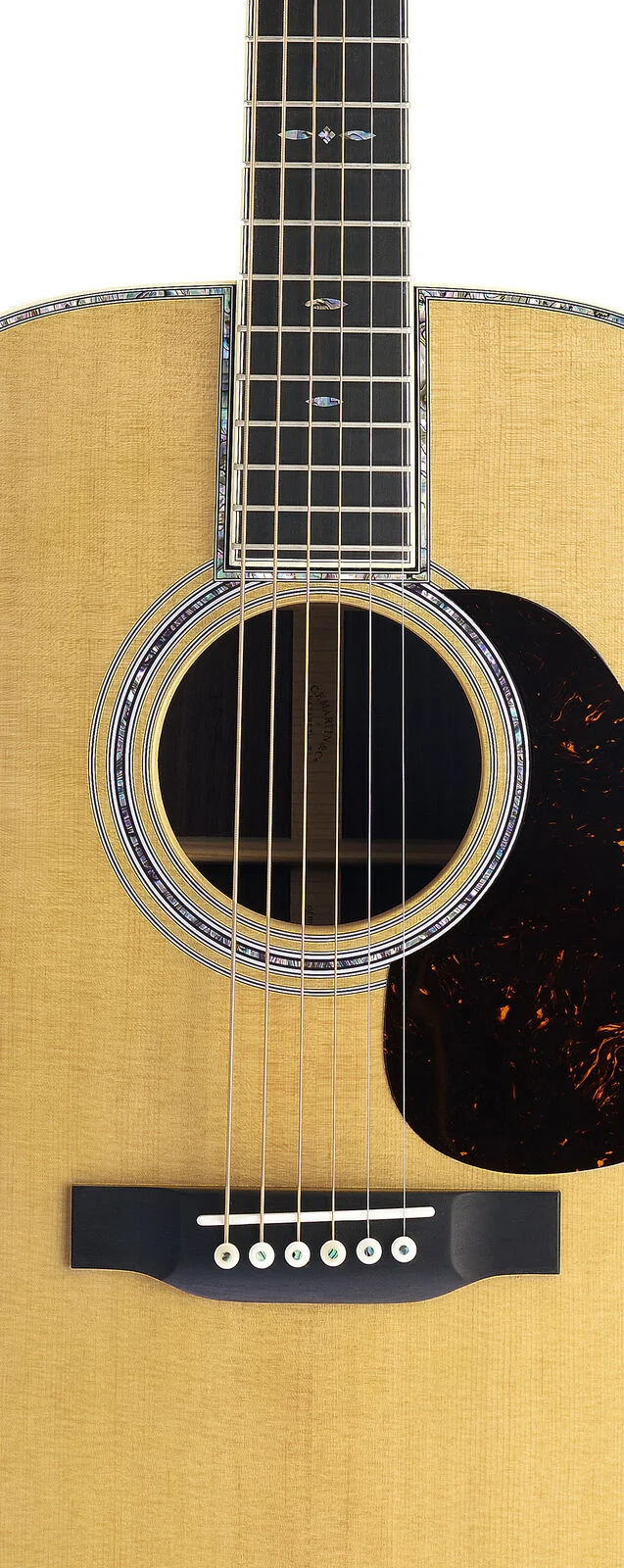 Close-up of an acoustic guitar with a focus on the soundhole and strings.