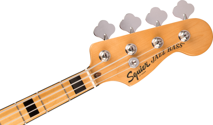Close-up of a Squier Jazz Bass guitar headstock on a white background